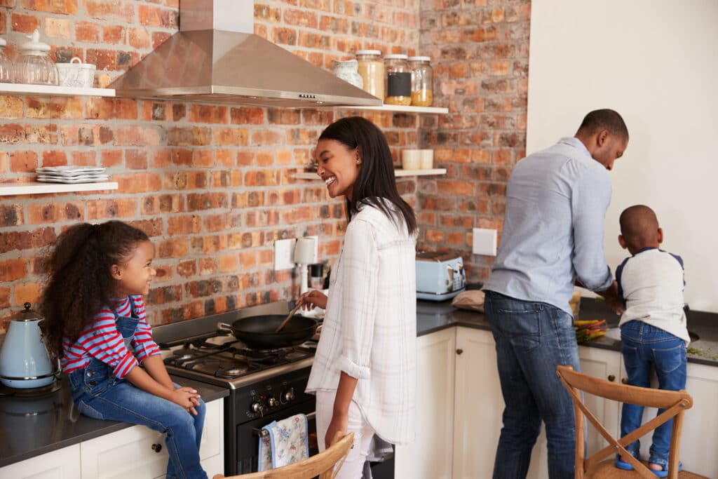 Happy family preparing a meal in the kitchen together